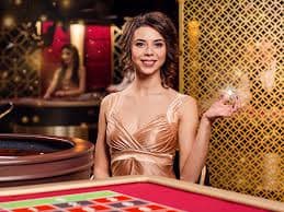 Live dealer Golden Toad slot game displayed on ratu123 login mobile phone with reel animation and real dealer